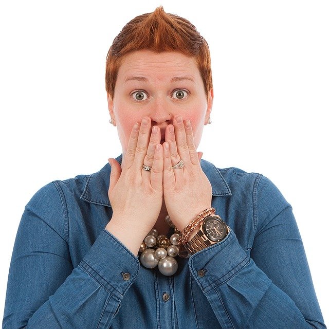 a woman with a shocked look on her face